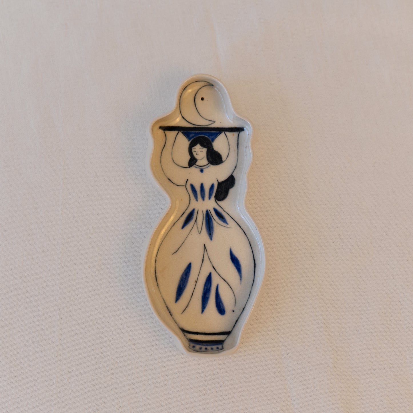 Handmade ceramic incense holder shaped as a woman carrying the moon